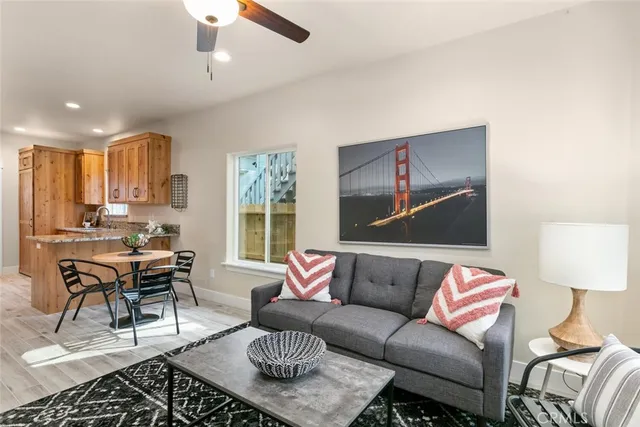 a kitchen with stainless steel appliances granite countertop cabinets and wooden floor