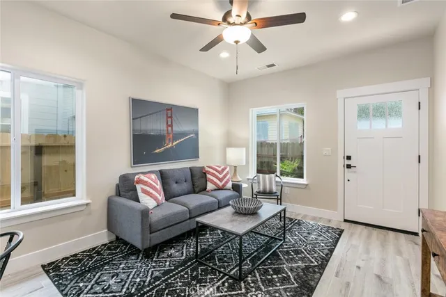 a kitchen with stainless steel appliances a stove sink microwave and cabinets