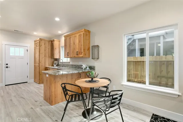 a kitchen with granite countertop a sink and a window