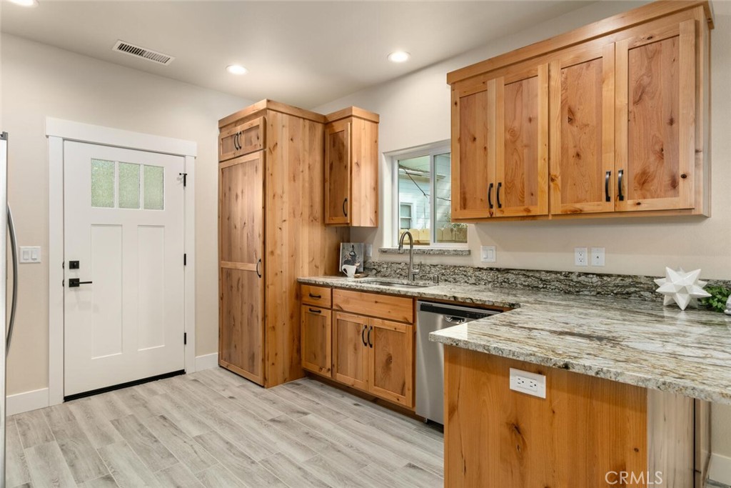 937 Chestnut Street Chico, CA 95928 - Photo 40 of 55 a kitchen with stainless steel appliances granite countertop cabinets and wooden floor