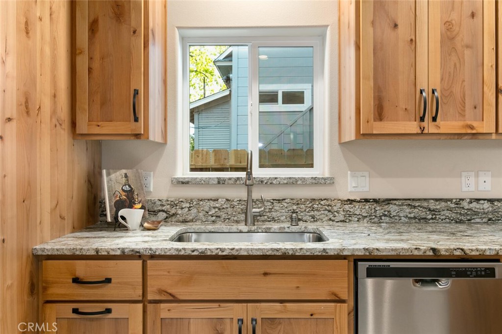 937 Chestnut Street Chico, CA 95928 - Photo 42 of 55 a kitchen with granite countertop a sink and a window