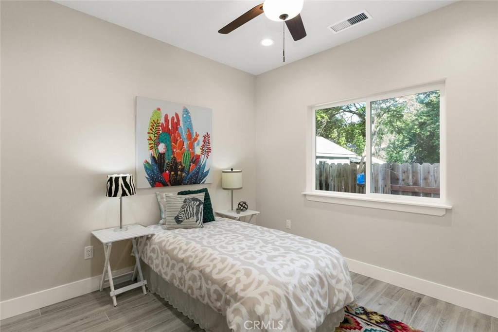937 Chestnut Street Chico, CA 95928 - Photo 43 of 55 a bedroom with a bed wall painting and a window