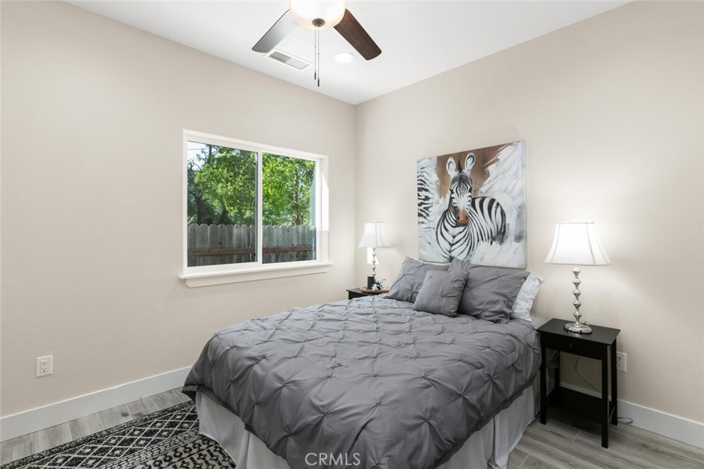 937 Chestnut Street Chico, CA 95928 - Photo 45 of 55 a bedroom with a large bed and a window