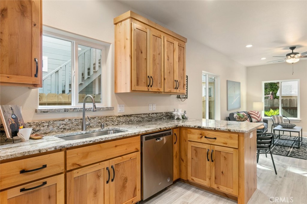 937 Chestnut Street Chico, CA 95928 - Photo 6 of 55 a kitchen with stainless steel appliances granite countertop a sink stove and cabinets