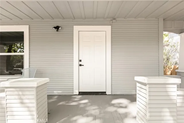 a kitchen with a large window and kitchen view