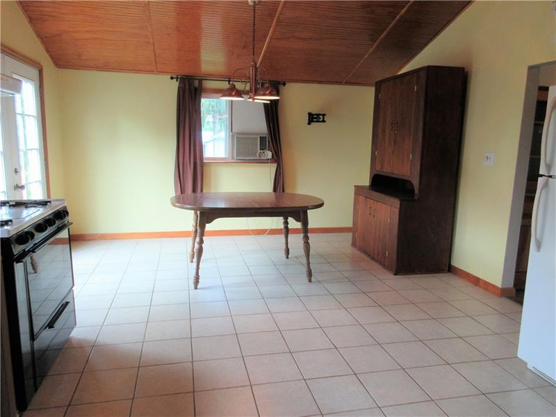 118 Grimm Road Sarver, PA 16055 - Photo 4 of 25 Large open dining area with a french door leading to the back yard and swimming pool.