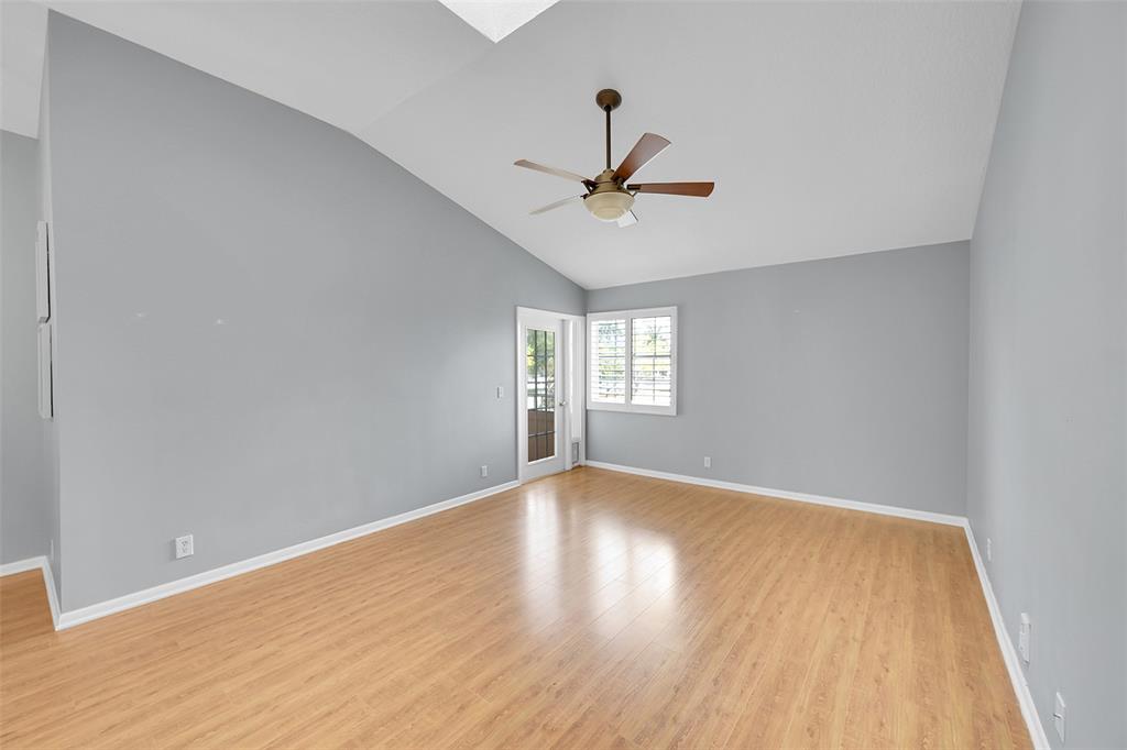 5307 Buckhead Circle, Unit 203 Boca Raton, FL 33431 - Photo 11 of 34 a view of empty room with wooden floor and fan