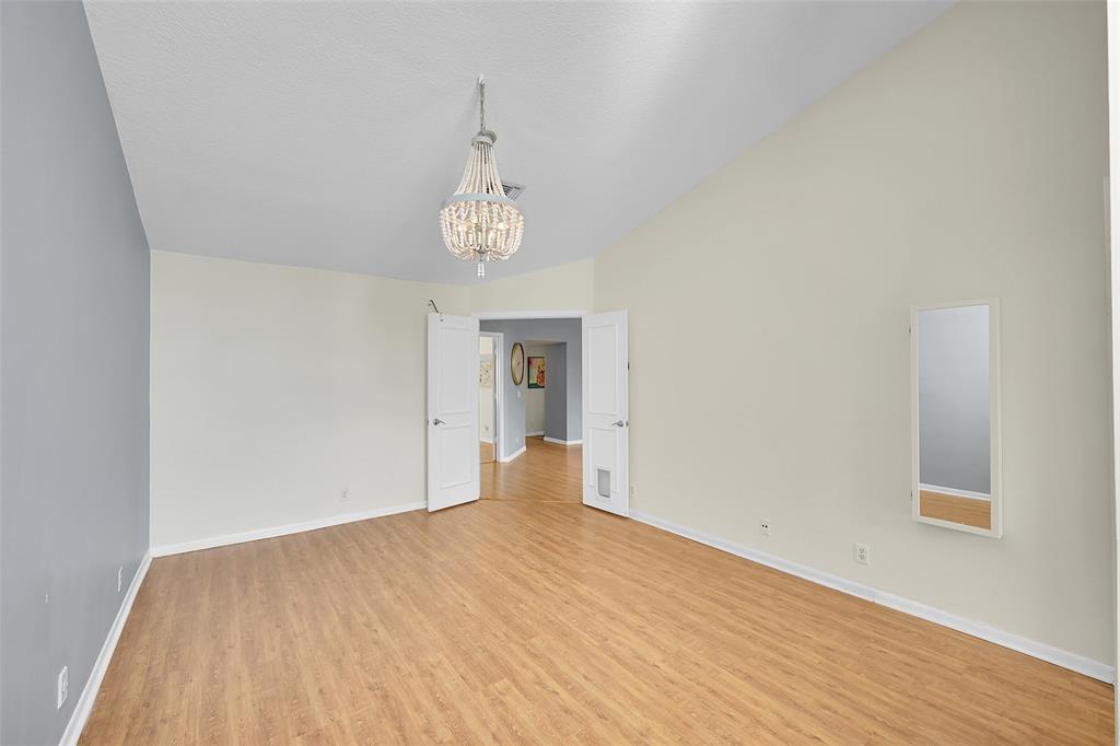 5307 Buckhead Circle, Unit 203 Boca Raton, FL 33431 - Photo 17 of 34 a view of empty room with wooden floor and window