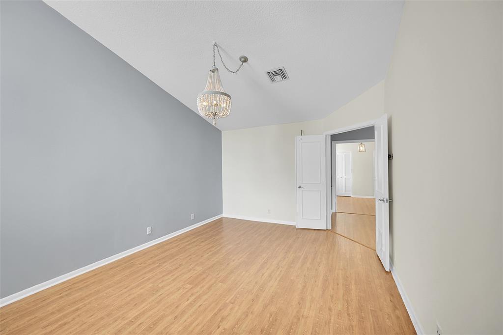 5307 Buckhead Circle, Unit 203 Boca Raton, FL 33431 - Photo 19 of 34 a view of a room with wooden floor and white walls