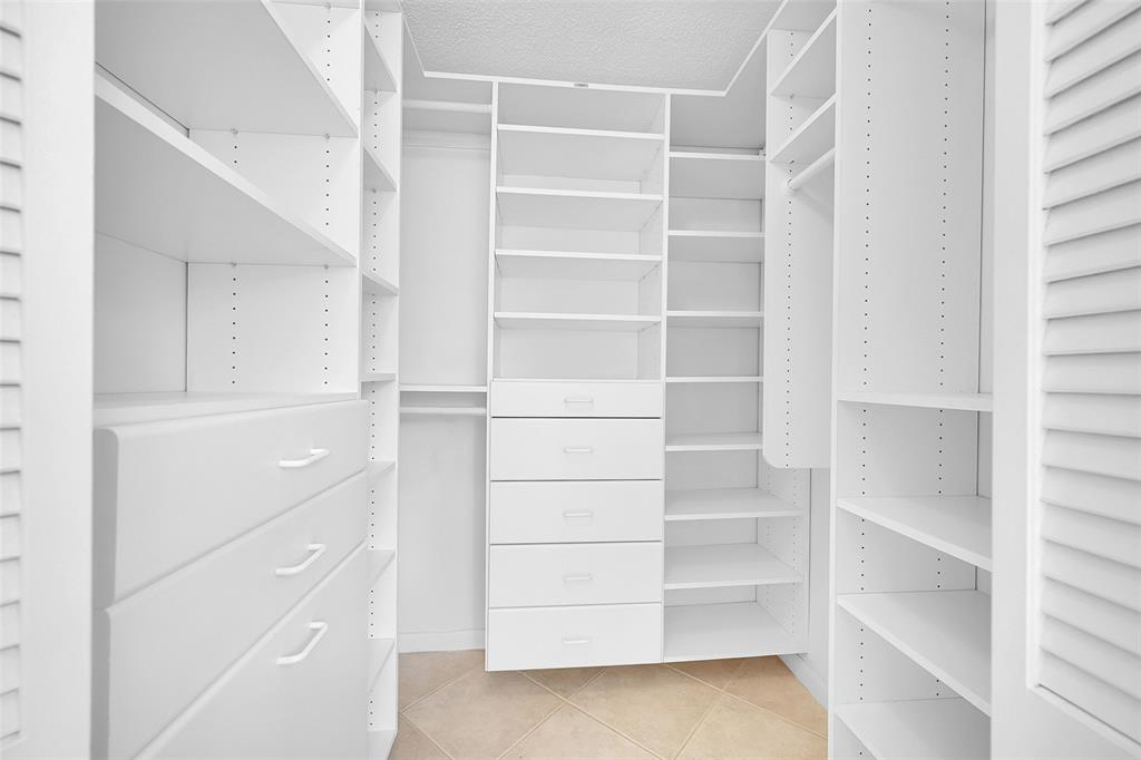 5307 Buckhead Circle, Unit 203 Boca Raton, FL 33431 - Photo 20 of 34 a view of walk in closet with empty racks