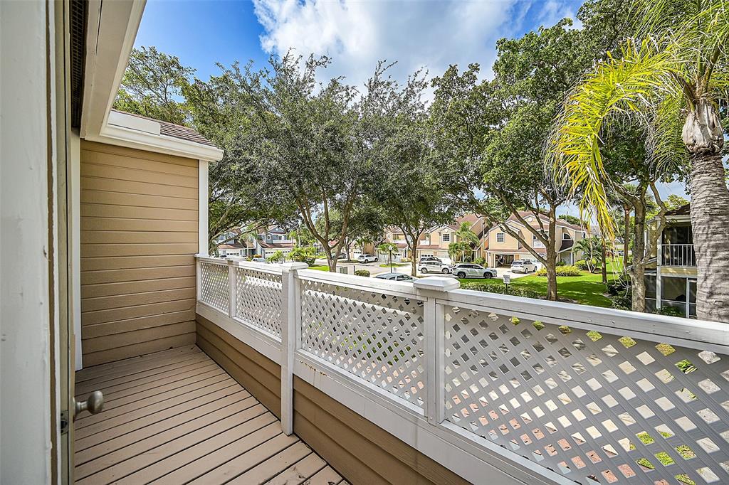 5307 Buckhead Circle, Unit 203 Boca Raton, FL 33431 - Photo 30 of 34 a view of a balcony with wooden fence