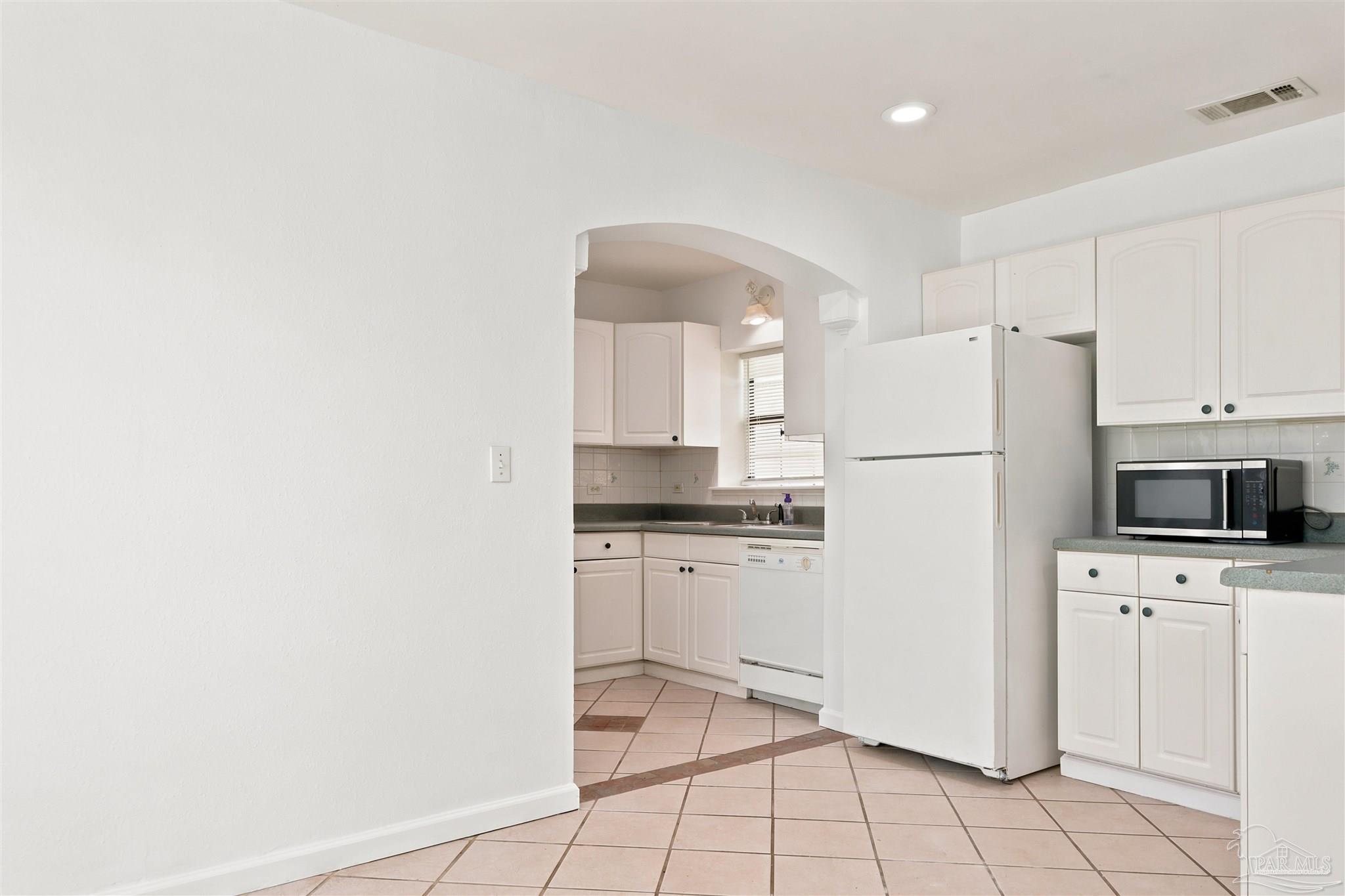 101 Vanderbilt Road Pensacola, FL 32506 - Photo 11 of 33 Kitchen, refrigerator and microwave