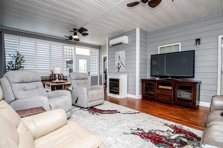 575 Liberty Church Road Carrollton, GA 30116 - Photo 30 of 95 a living room with furniture and a flat screen tv