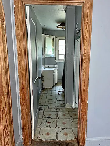 a view of a hallway with a dining area