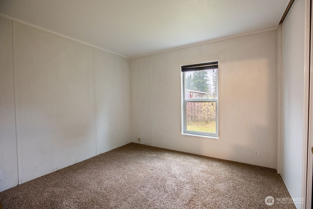 230 Misty Circle Forks, WA 98331 - Photo 4 of 33 an empty room with a window and front door