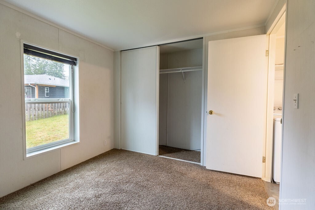 230 Misty Circle Forks, WA 98331 - Photo 5 of 33 an empty room with windows and closet