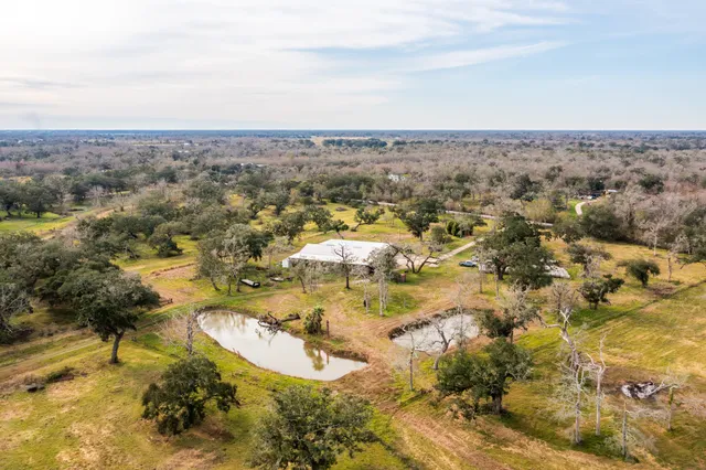 an aerial view of residential houses with outdoor space