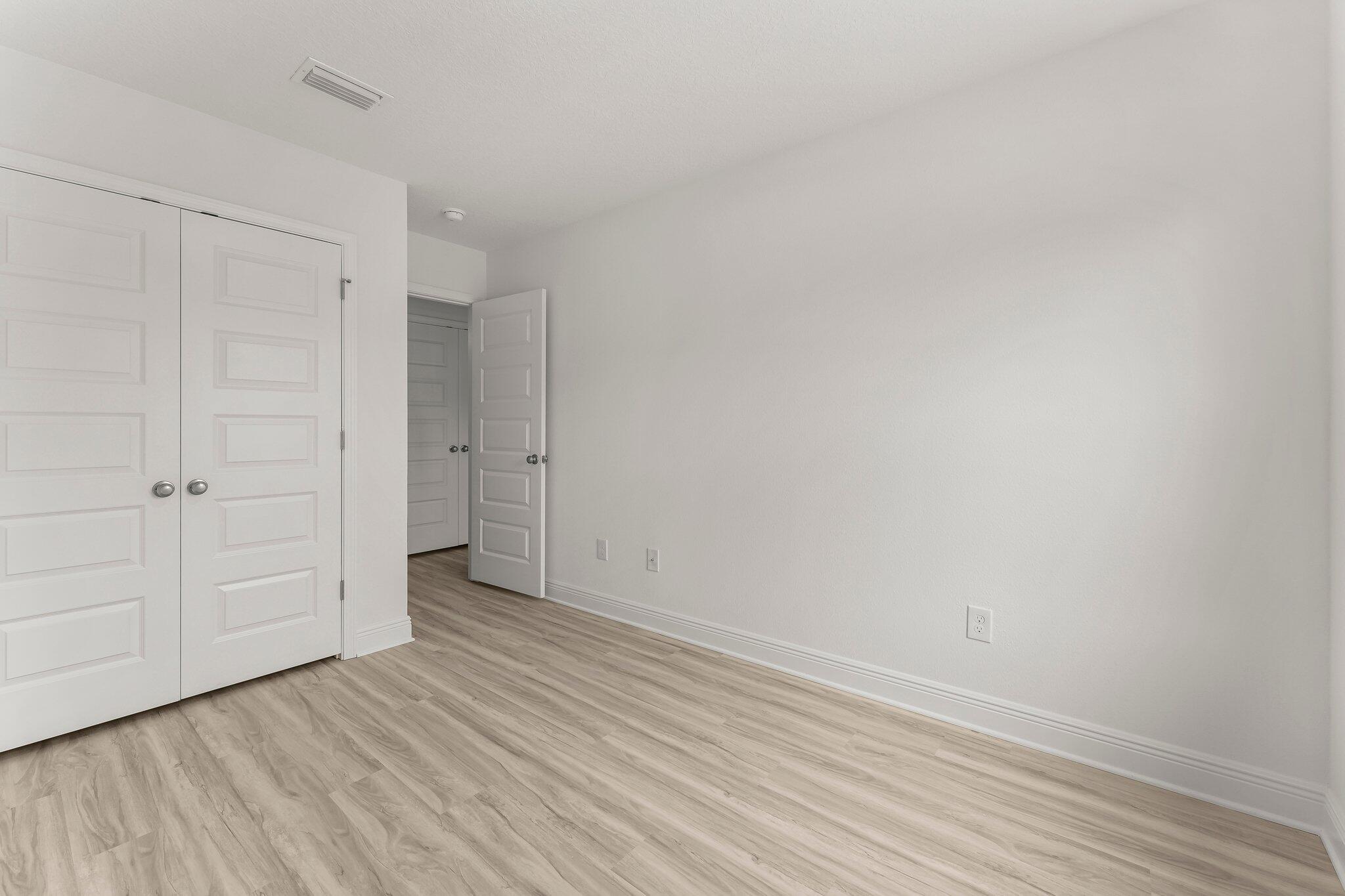 18 Hawk Street Santa Rosa Beach, FL 32459 - Photo 26 of 34 a view of an empty room with wooden floor