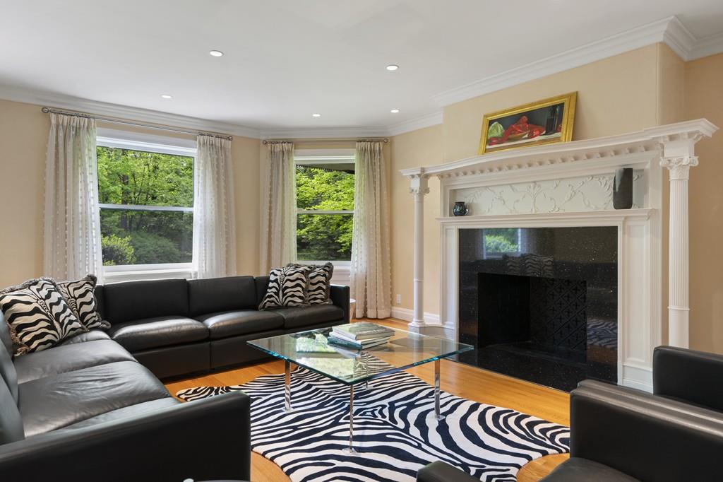 30 Warren Street Brookline, MA 02445 - Photo 18 of 27 a living room with furniture and a fireplace
