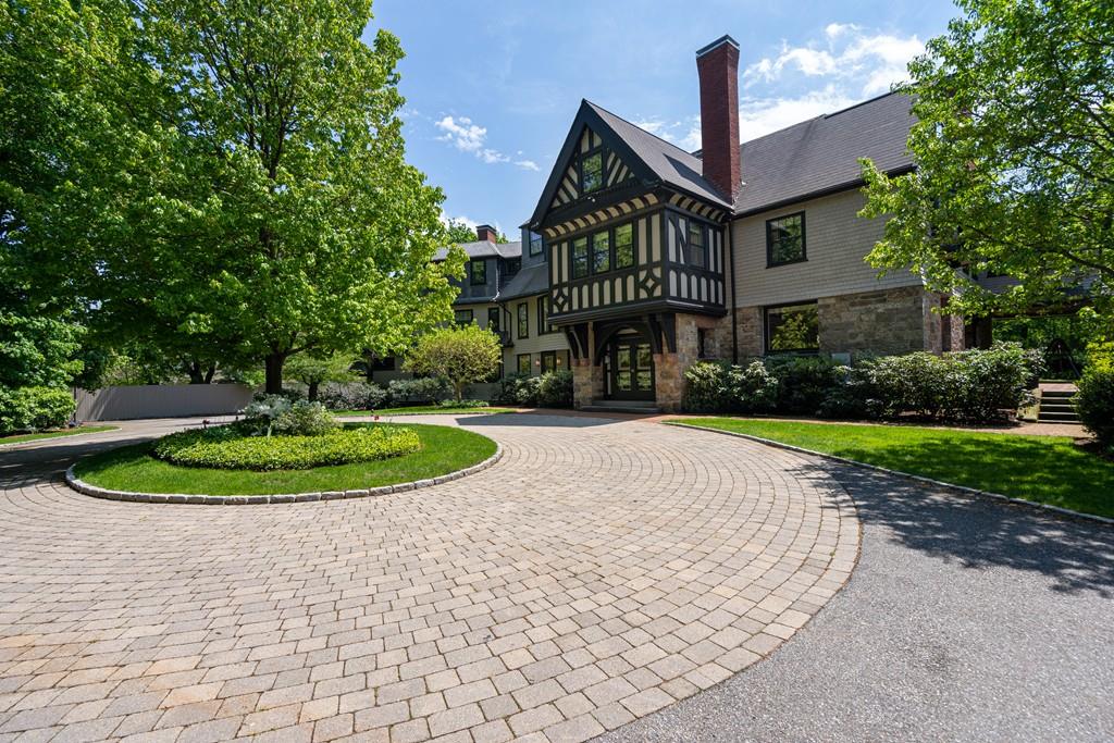 30 Warren Street Brookline, MA 02445 - Photo 2 of 27 a front view of a house with a yard