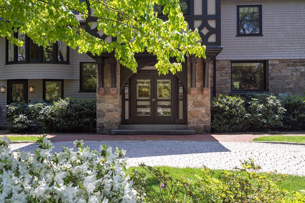 30 Warren Street Brookline, MA 02445 - Photo 4 of 27 a front view of a house with garden