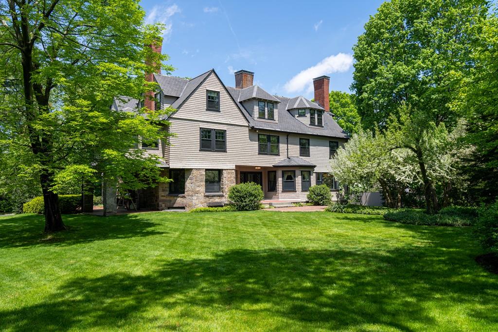 30 Warren Street Brookline, MA 02445 - Photo 5 of 27 a front view of a house with a yard