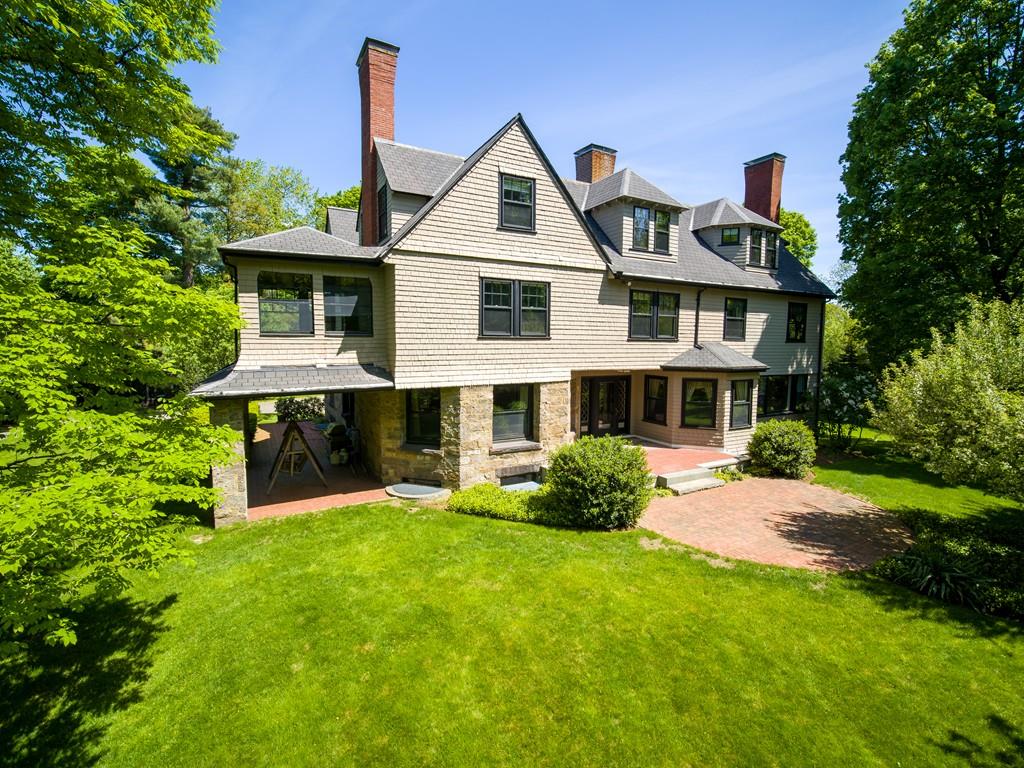 30 Warren Street Brookline, MA 02445 - Photo 6 of 27 a front view of a house with a yard