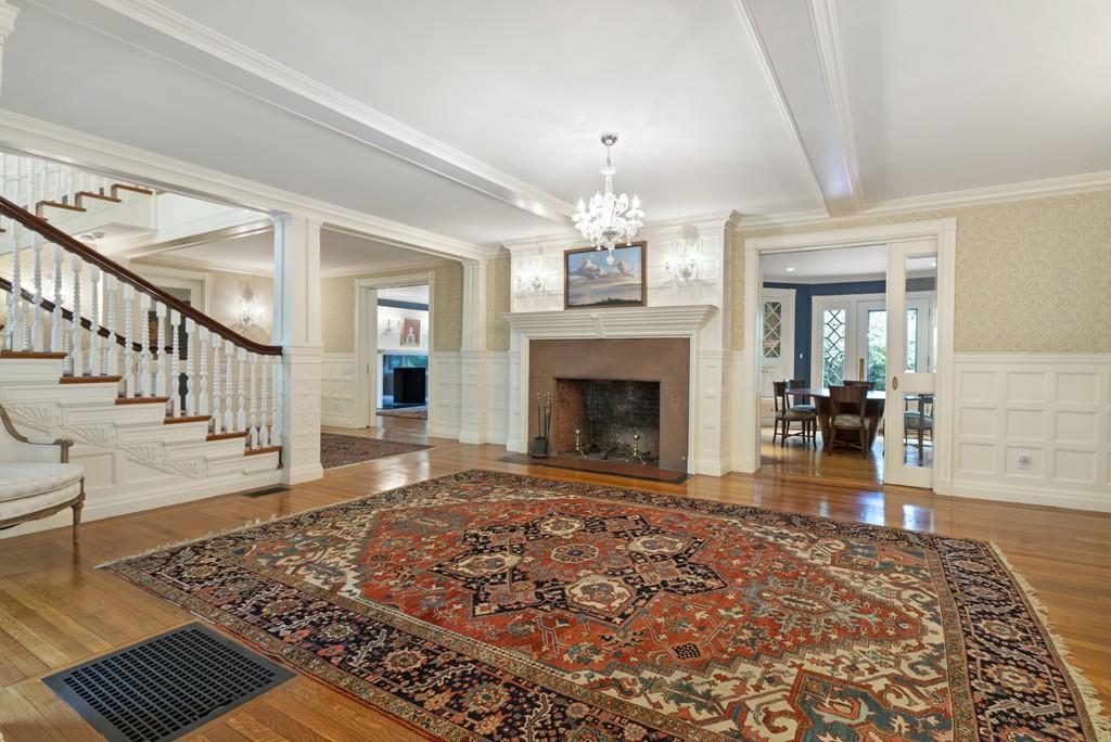 30 Warren Street Brookline, MA 02445 - Photo 10 of 27 a living room with wooden floor and a fireplace