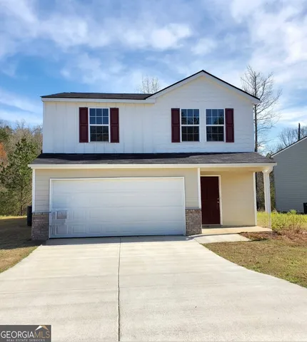a front view of a house with a garage