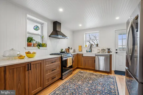a kitchen with a sink cabinets and stainless steel appliances