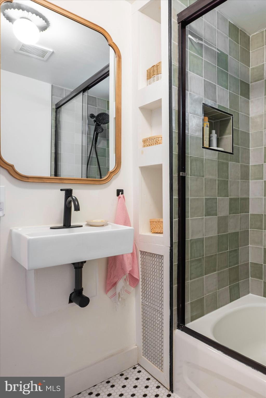 6626 Musgrave Street Philadelphia, PA 19119 - Photo 14 of 26 a bathroom with a sink and a mirror