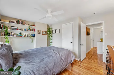 a bed room with a bed and a lamp