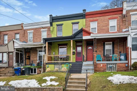 a front view of a house with a porch