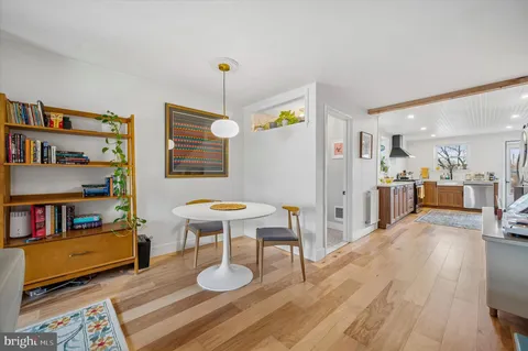 a view of kitchen island with furniture and wooden floor