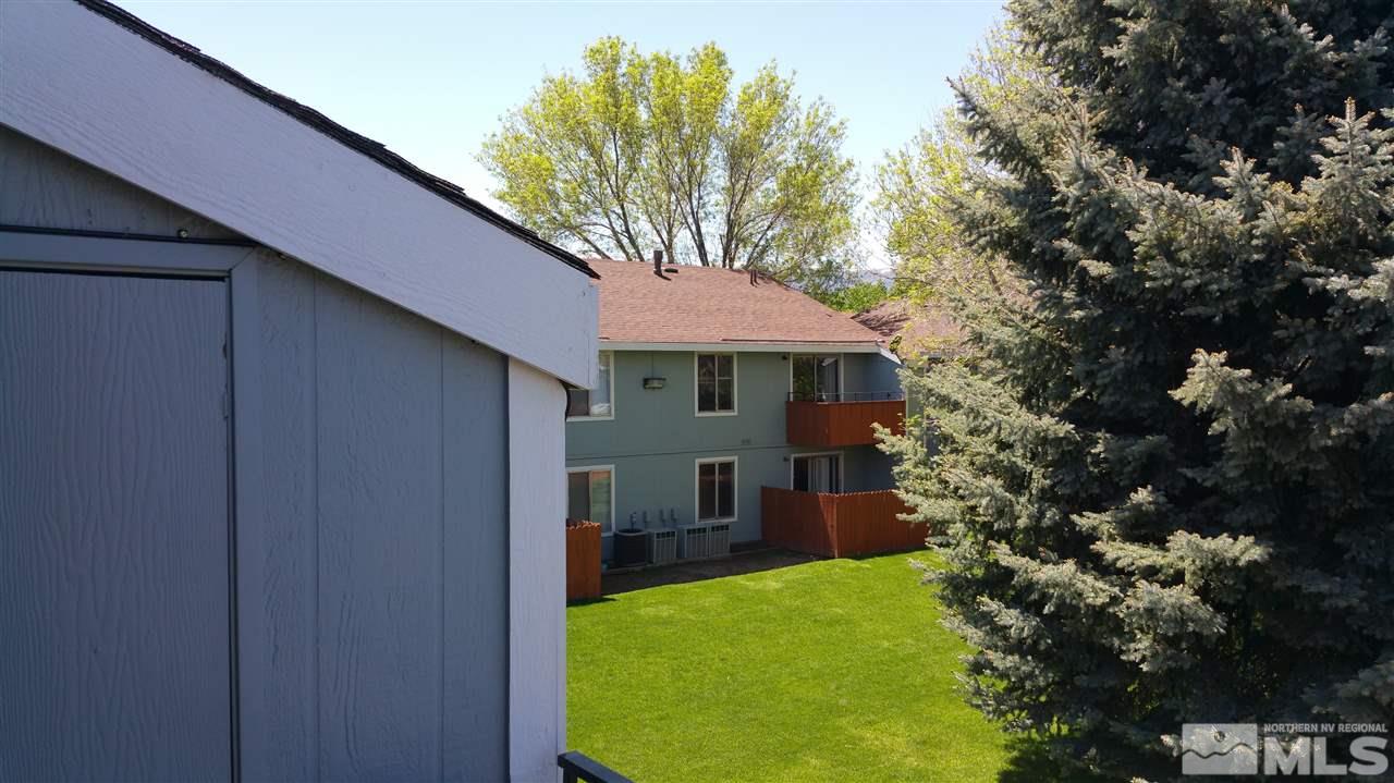 4600 Neil Road, Unit 12 Reno, NV 89502 - Photo 1 of 1 a front view of a house with garden