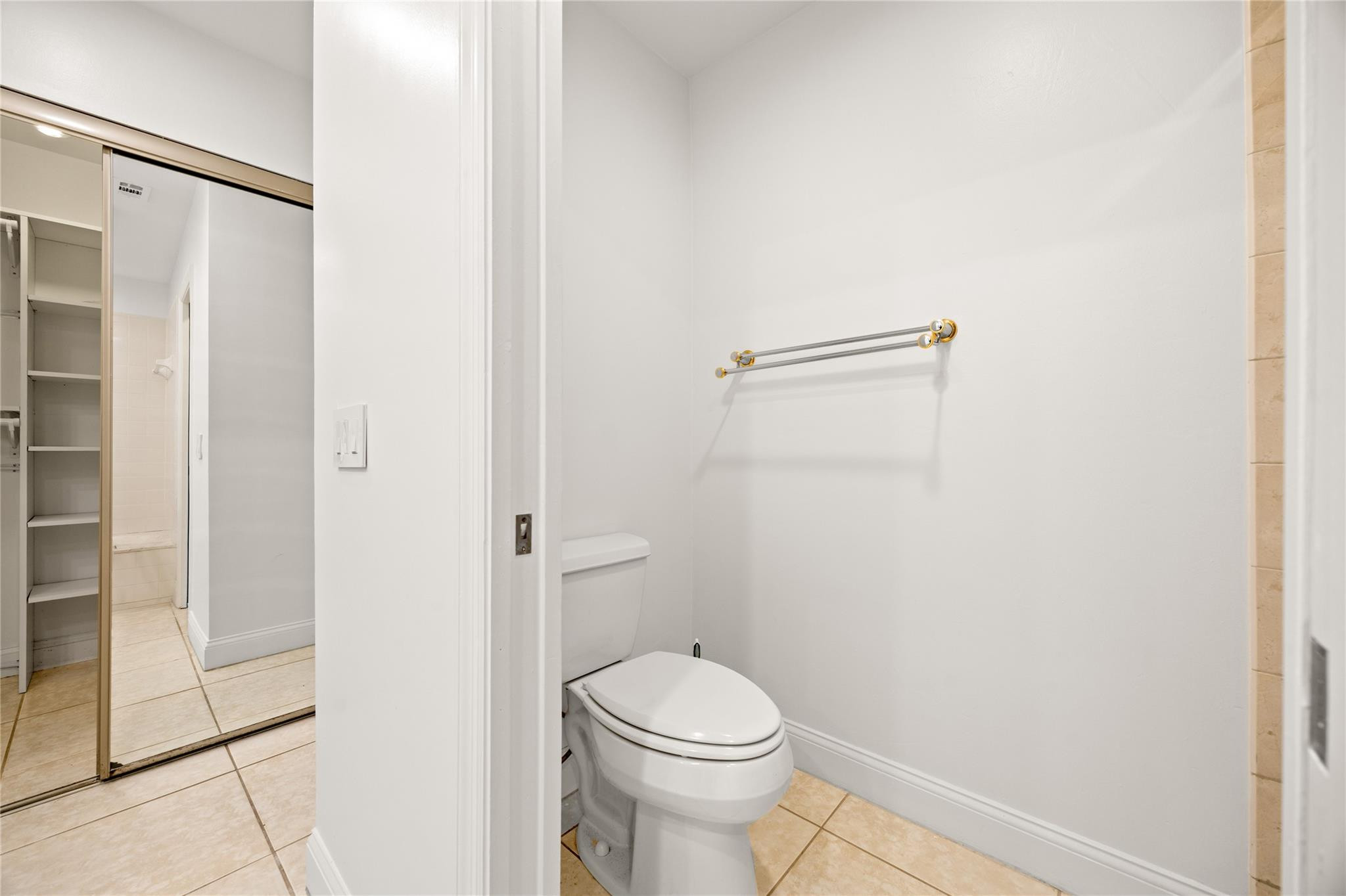 6825 Allegre Court Boca Raton, FL 33433 - Photo 15 of 31 a bathroom with a toilet and a shower