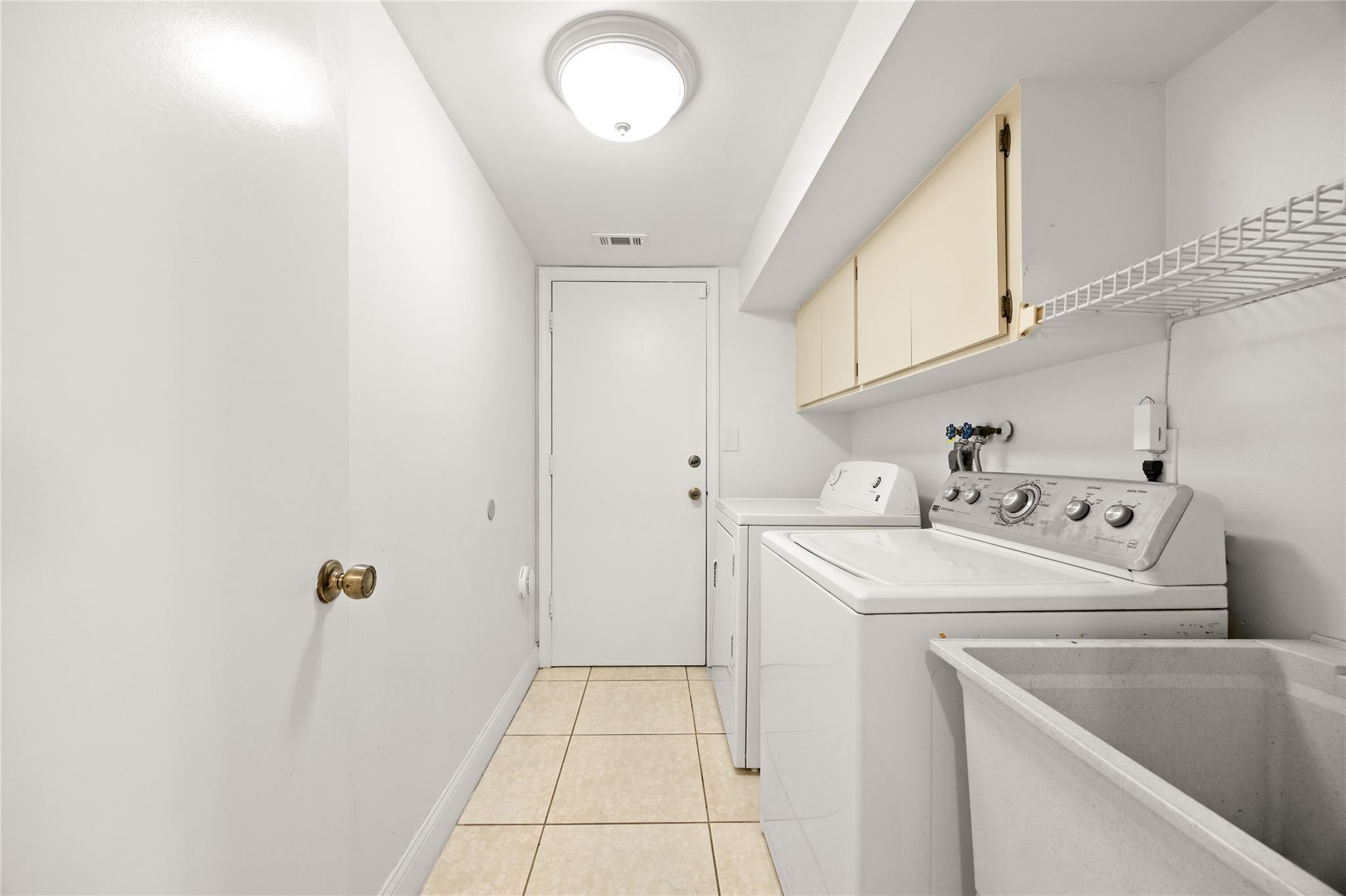 6825 Allegre Court Boca Raton, FL 33433 - Photo 17 of 31 a utility room with dryer and washer