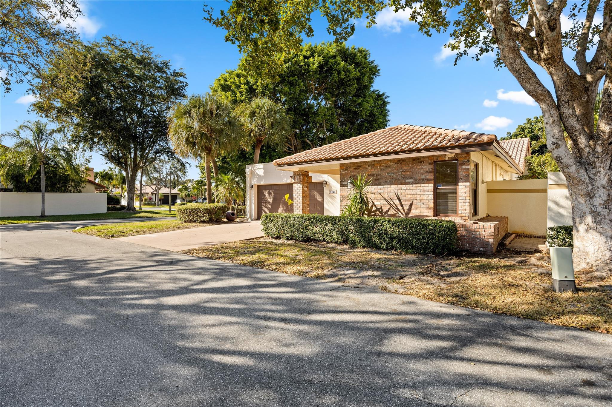 6825 Allegre Court Boca Raton, FL 33433 - Photo 30 of 31 a view of a house with a yard and large tree