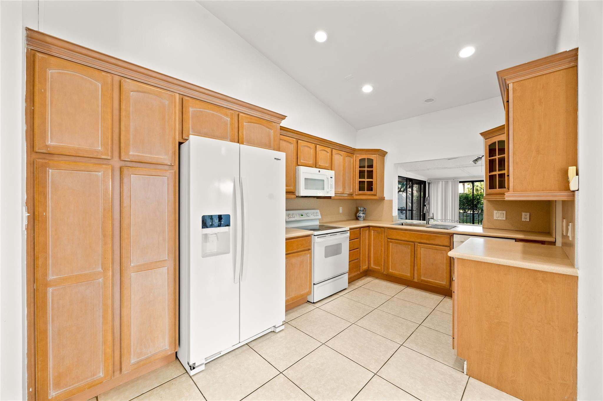 6825 Allegre Court Boca Raton, FL 33433 - Photo 4 of 31 a kitchen with stainless steel appliances granite countertop a refrigerator and a stove top oven