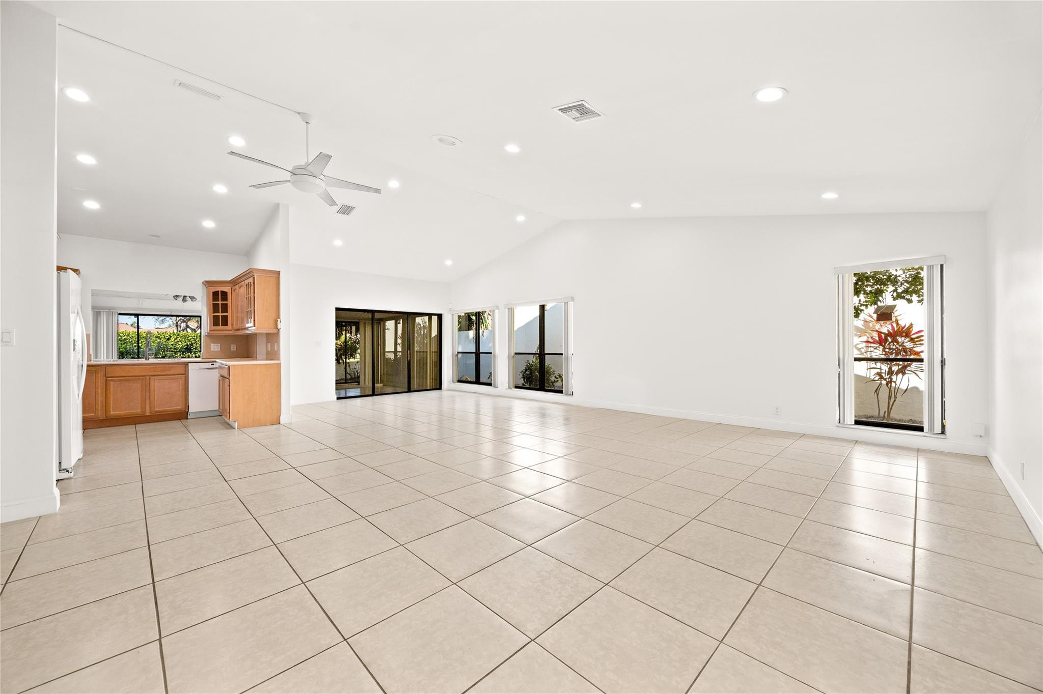 6825 Allegre Court Boca Raton, FL 33433 - Photo 7 of 31 a view of an empty room and kitchen with furniture