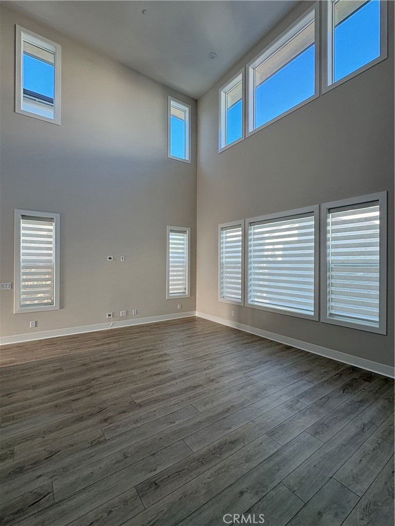 160 Longden Lake Forest, CA 92630 - Photo 11 of 31 a view of an empty room with wooden floor and a window