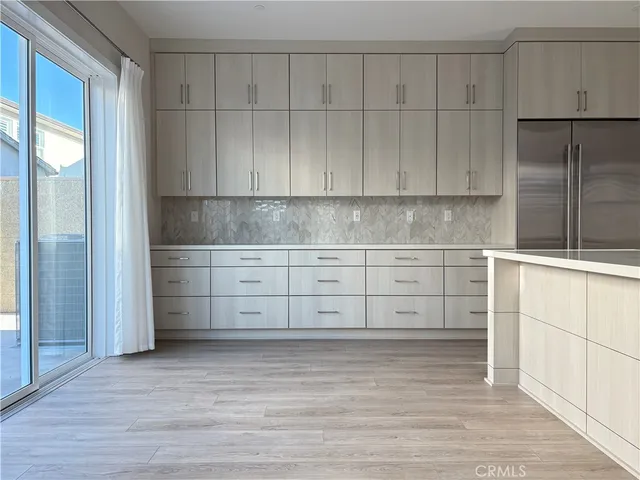 a view of cabinets and wooden floor