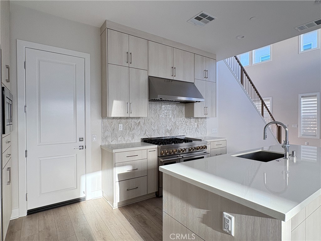 160 Longden Lake Forest, CA 92630 - Photo 15 of 31 a kitchen with cabinets and a stove