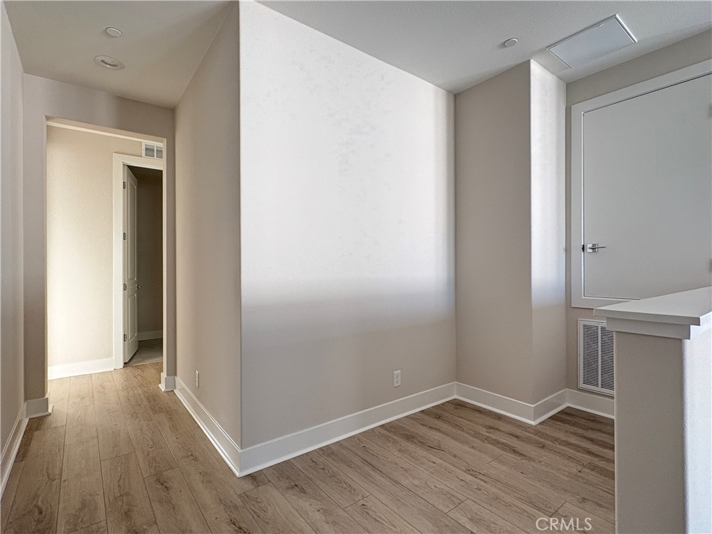 160 Longden Lake Forest, CA 92630 - Photo 16 of 31 an empty room with wooden floor and closet