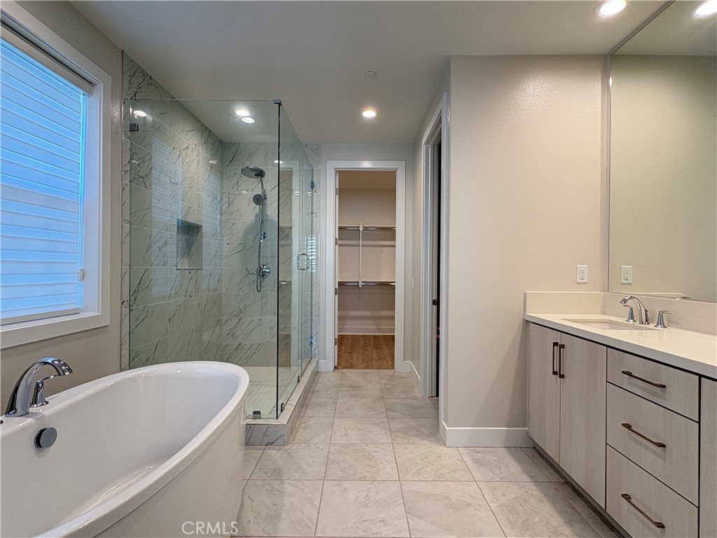 160 Longden Lake Forest, CA 92630 - Photo 20 of 31 a bathroom with a tub sink toilet and shower