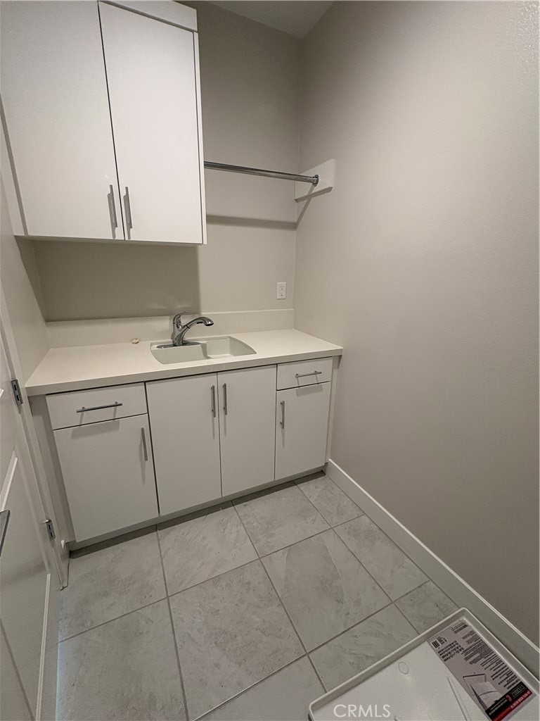 160 Longden Lake Forest, CA 92630 - Photo 24 of 31 a room with a sink and cabinets