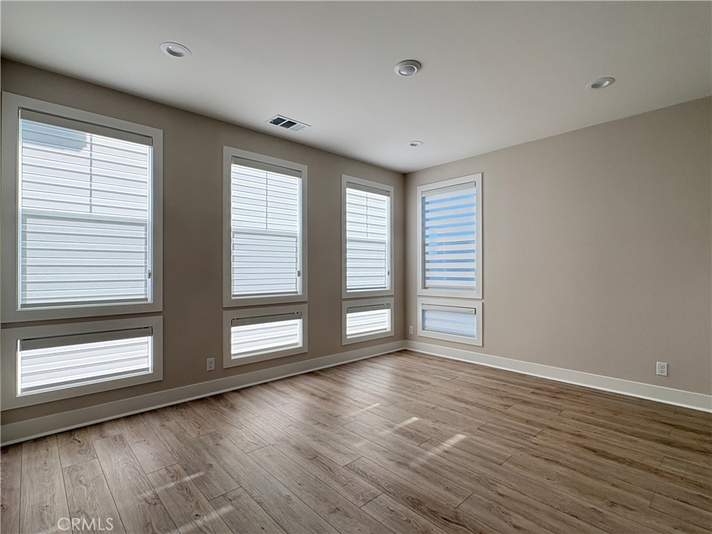 160 Longden Lake Forest, CA 92630 - Photo 25 of 31 a view of an empty room with wooden floor and a window
