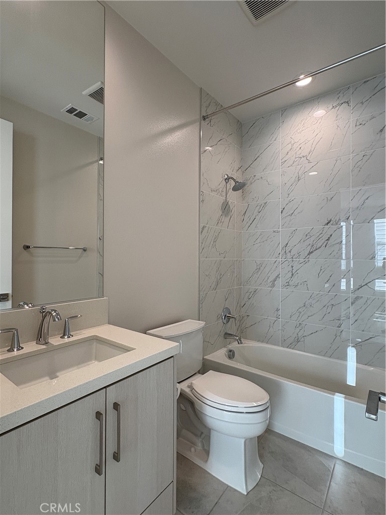 160 Longden Lake Forest, CA 92630 - Photo 26 of 31 a bathroom with a toilet sink vanity granite and shower