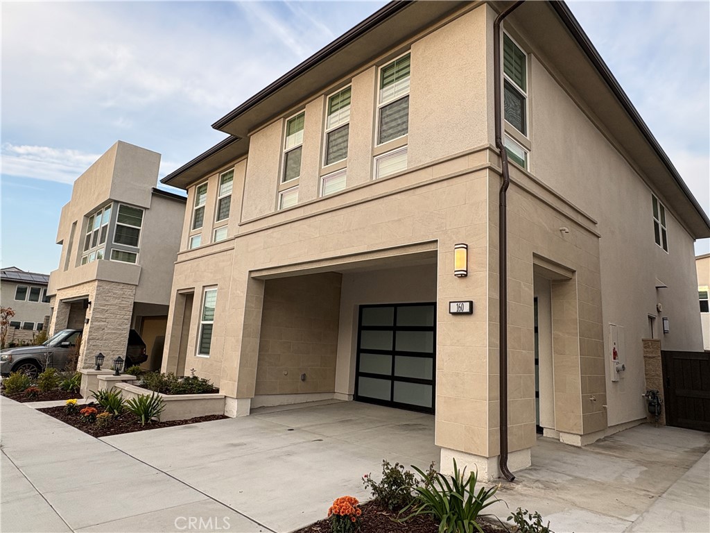 160 Longden Lake Forest, CA 92630 - Photo 3 of 31 a view of a white house with a large windows