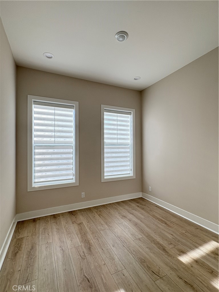 160 Longden Lake Forest, CA 92630 - Photo 6 of 31 a view of an empty room with wooden floor and a window
